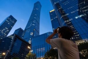 Small aircraft crashes into Beijing’s tallest building, according to flight tracking service