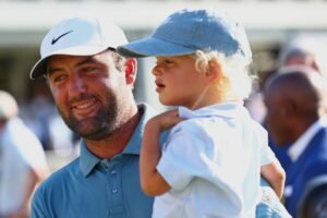 Scottie Scheffler moves past a…
