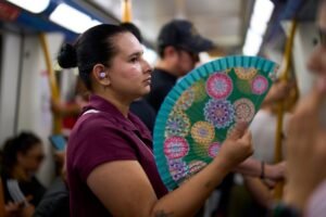 In a scorching Spain, the traditional folding hand fan is having a moment